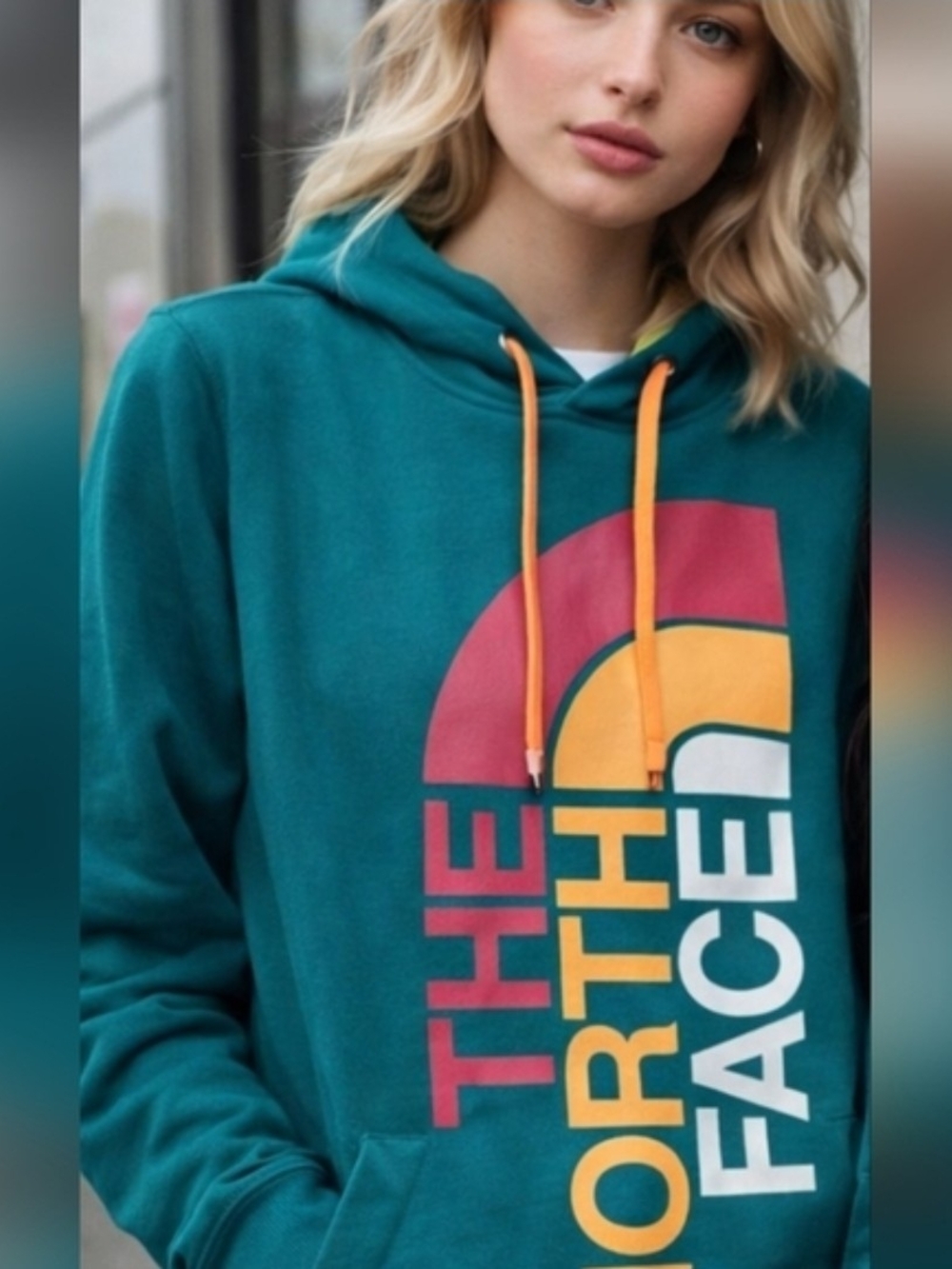 The North Face Teal Hoodie with Yellow Drawstrings and Multicolor Logo